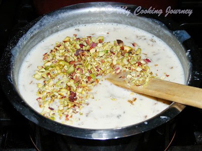 Adding pista to ice cream mix Adding pista to ice cream mix