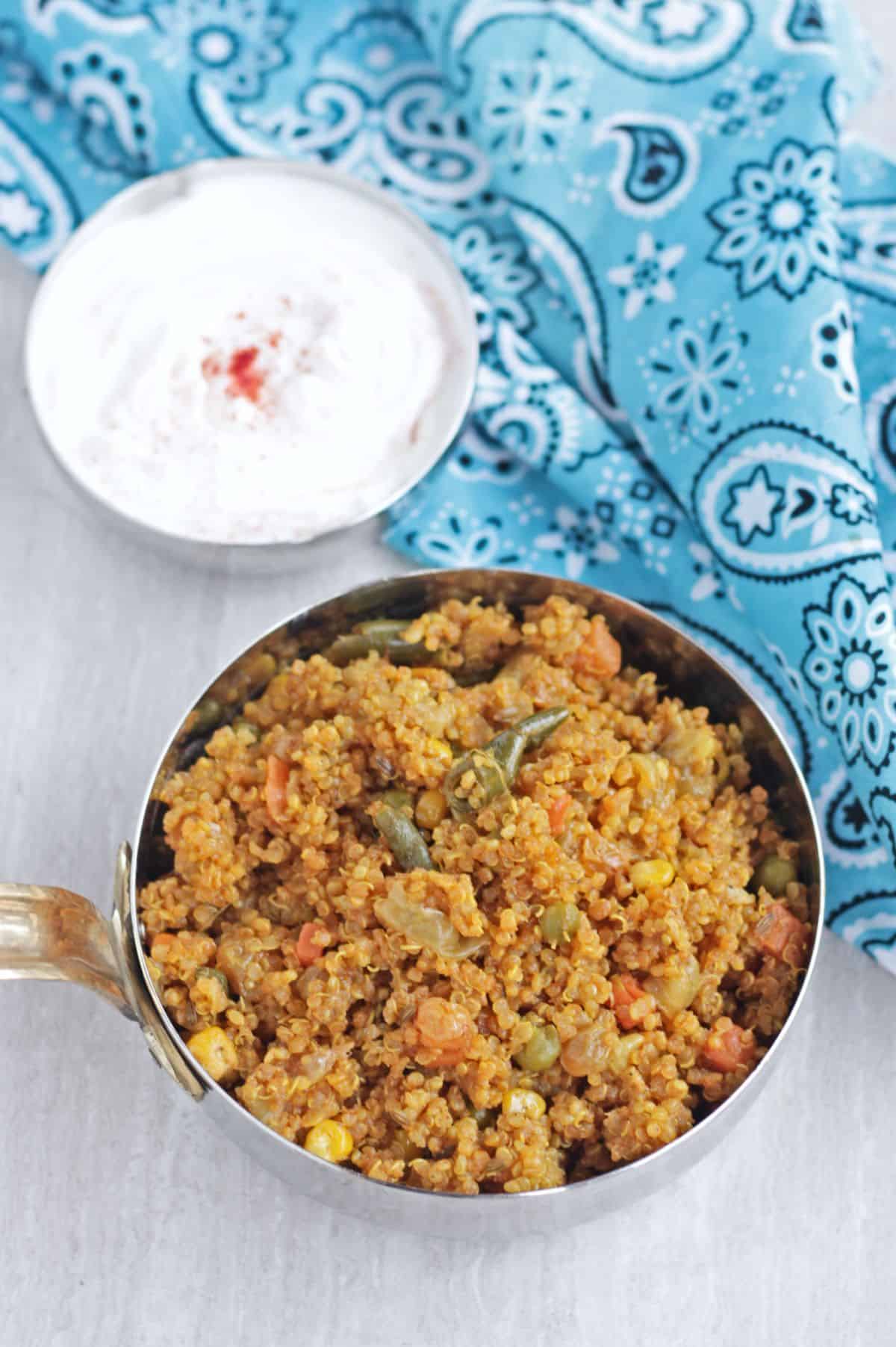 quinoa pulav with raita in the background