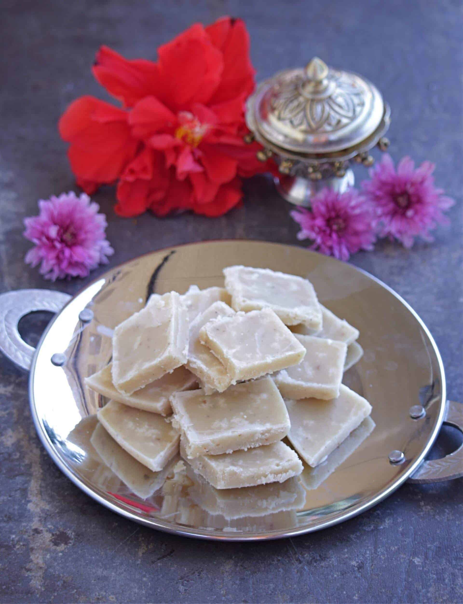 Maida Burfi for Diwali with flowers in the background