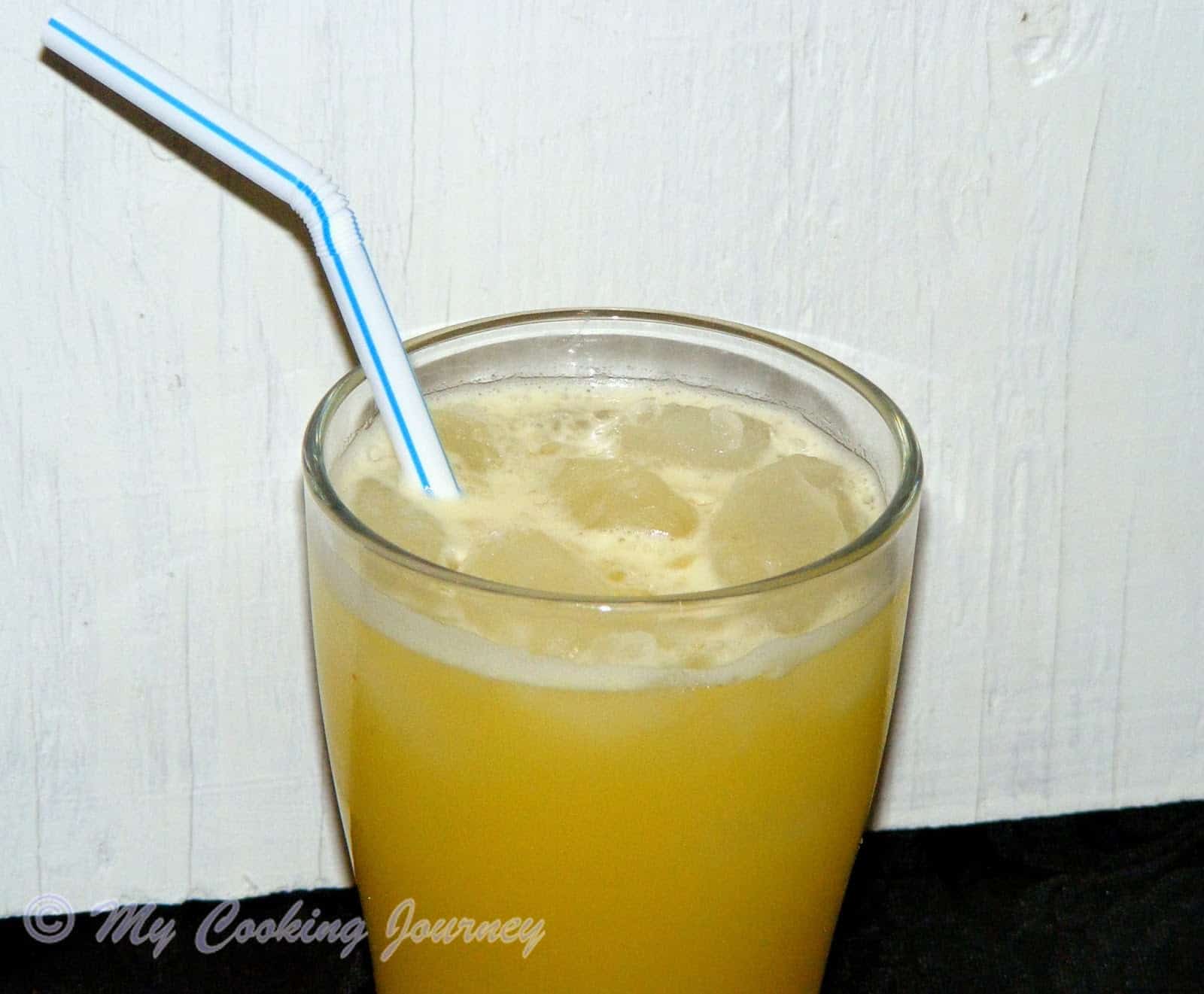 Ginger Beer in a glass with straw