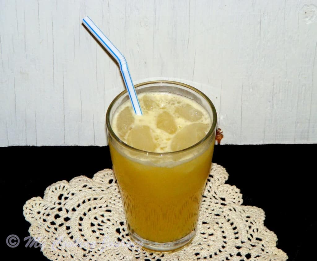 African Ginger Beer in glass with straw