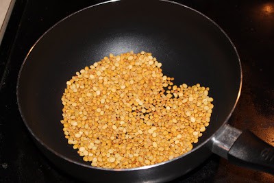 frying the lentil in a pan