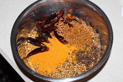 all the ingredients in a bowl for rasam powder
