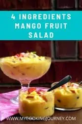 fruit salad with mango in glass bowl