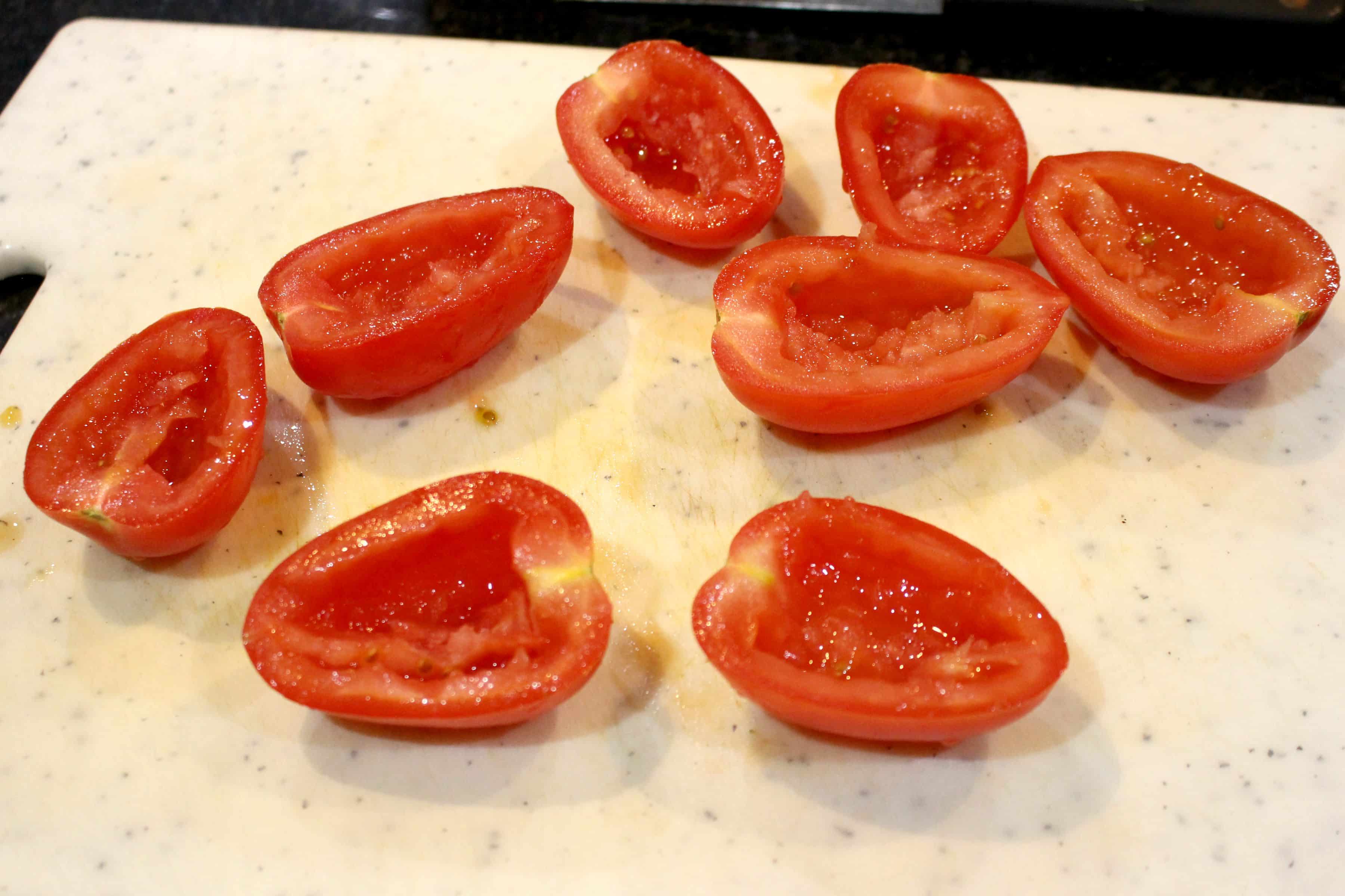 Seedless tomatoes cut into half.