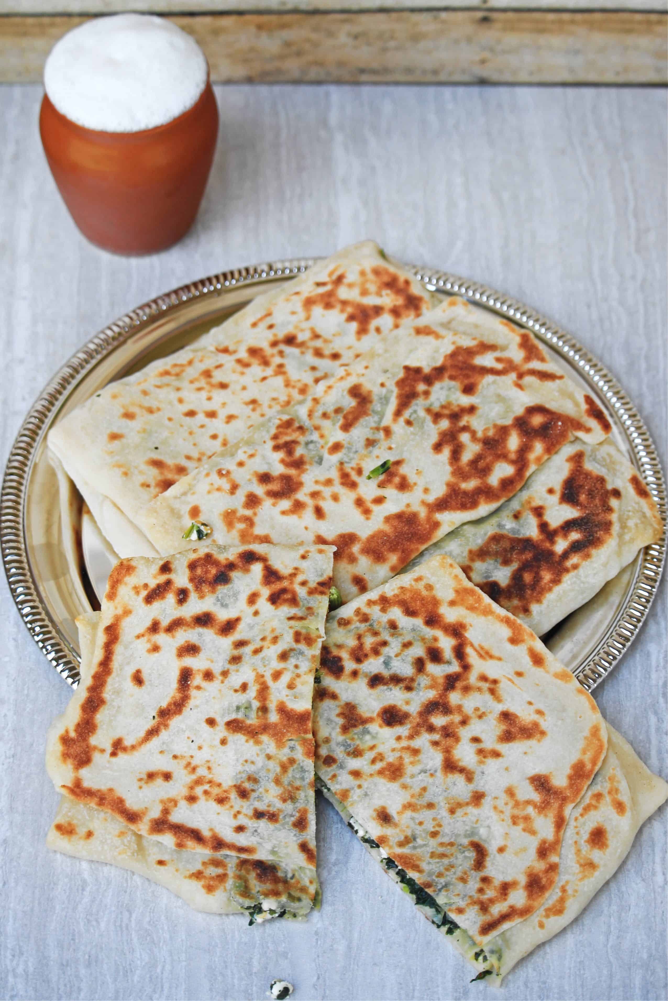 gozleme flatbread sliced and served with buttermilk