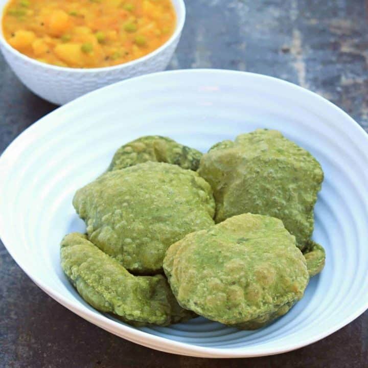 palak poori in a white bowl