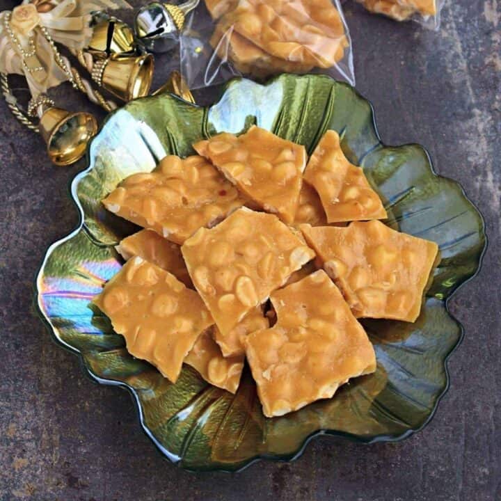 peanut brittle in a green bowl