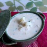 potato raita in a green bowl