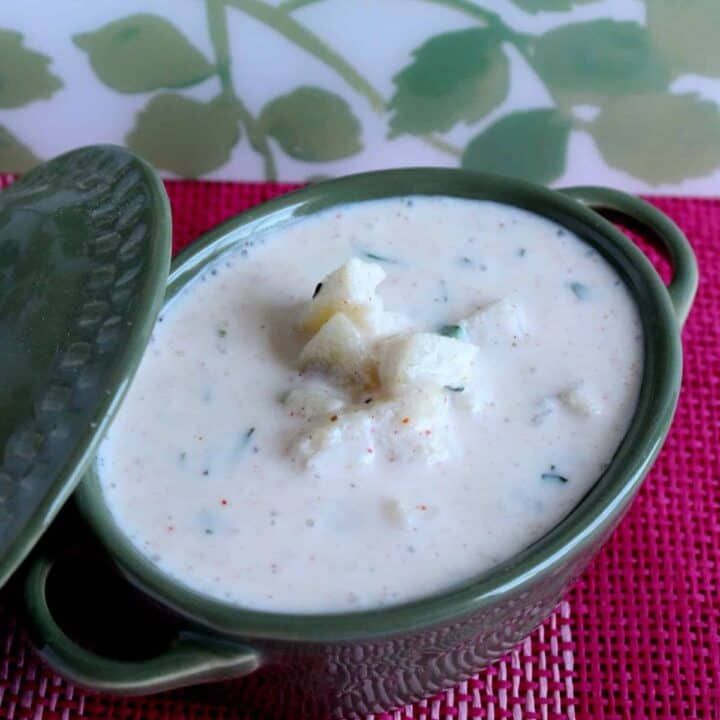 potato raita in a green bowl