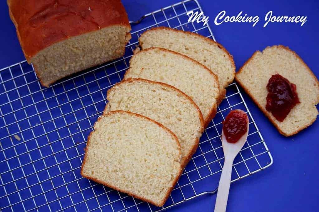 Buttermilk Bread with jam on a wire rack