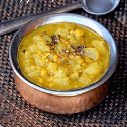 Kerala Style Poosinikkai Kootu Curry in a pot