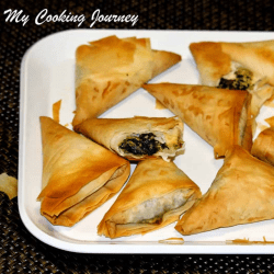 Spinach And Paneer Samosas in a tray
