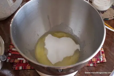 Adding sugar and other ingredients in a bowl