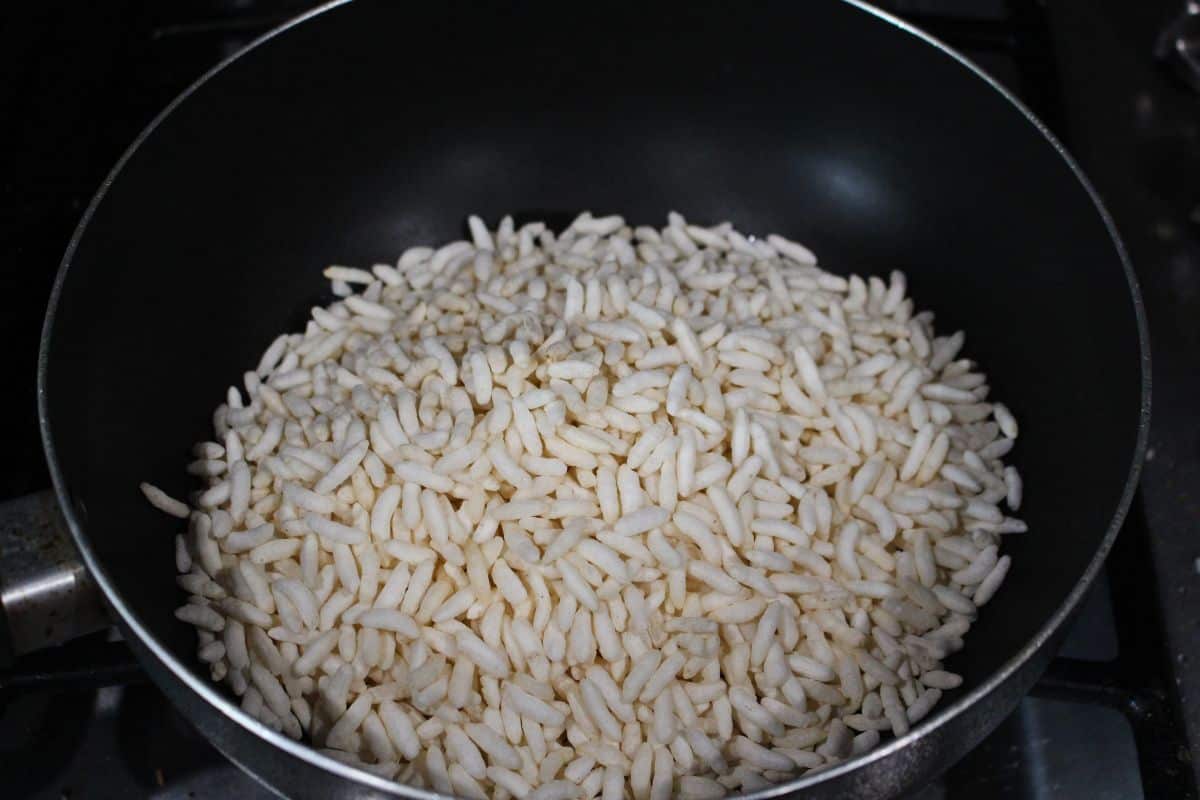 roasting the puffed rice in a pan