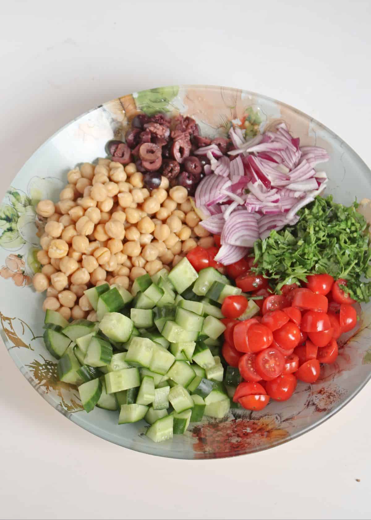 chopped vegetables and chickpeas in a bowl