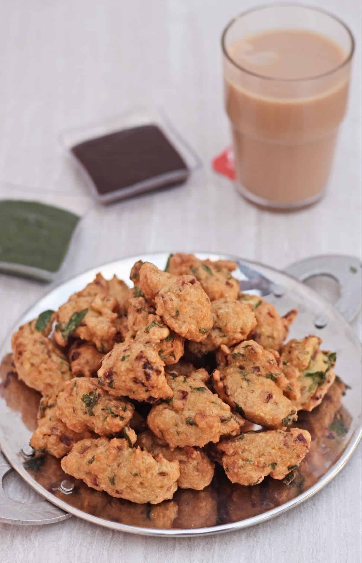 Moon dal pakoda with chutney and tea in the background