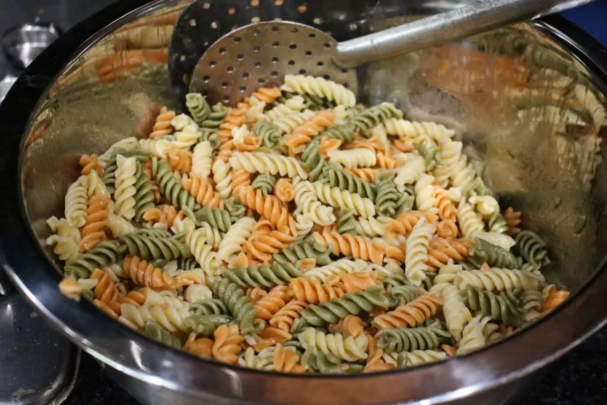 cooked tri color rotini pasta in a bowl