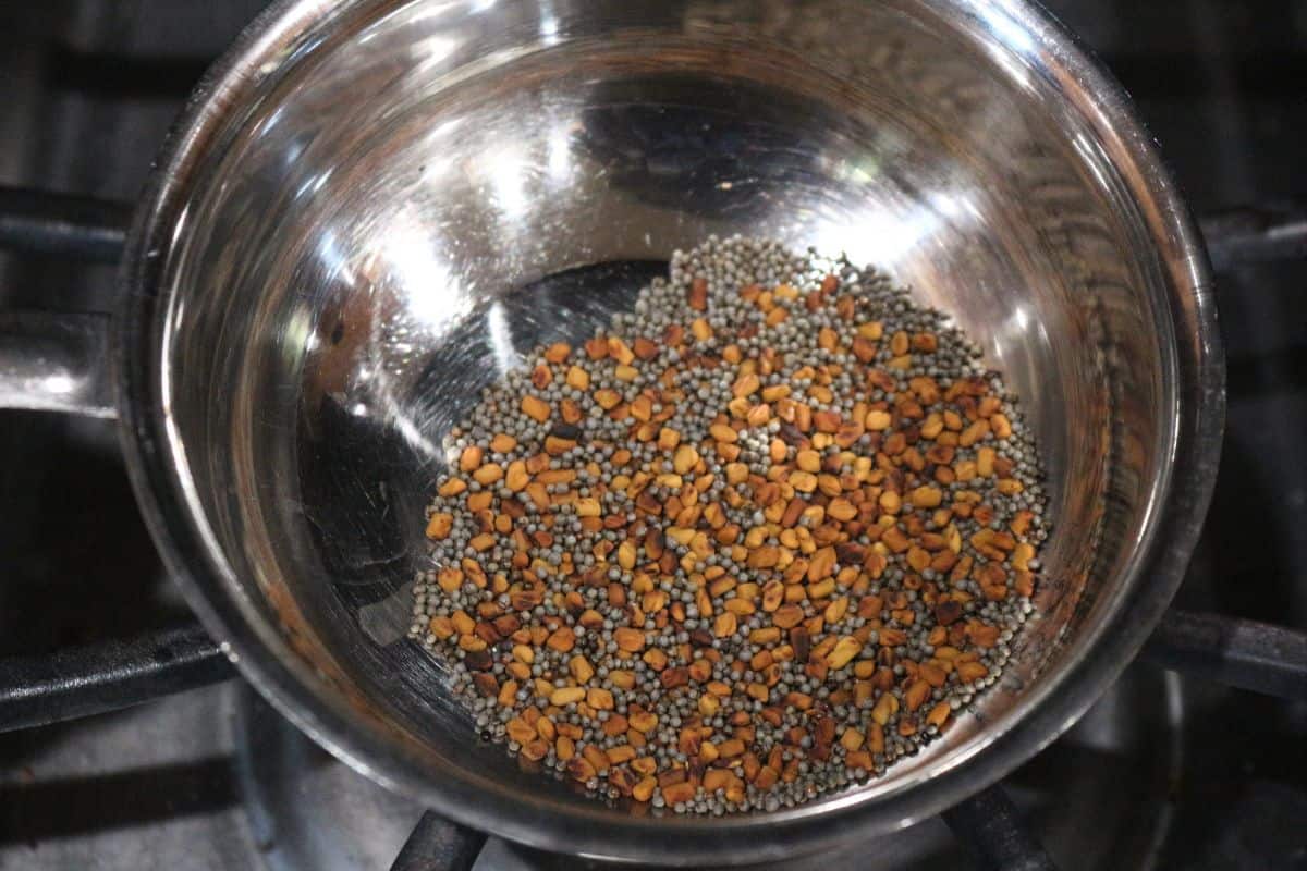 roasted mustard and fenugreek seeds in a pan
