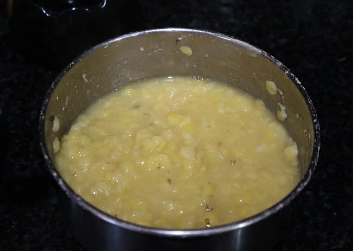 Cooked Toor Dal in a steel bowl.