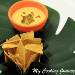 Tortilla Chips with Cheese Sauce served in a dish