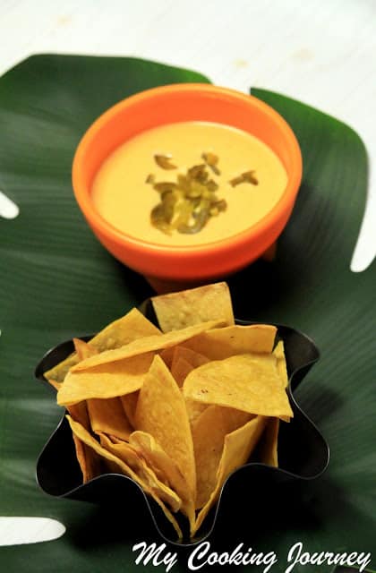Cheese sauce and Tortilla chips in a bowl