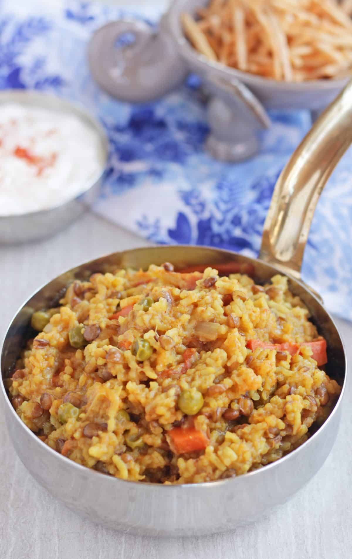 masala khichdi with vegetables in a serving bowl