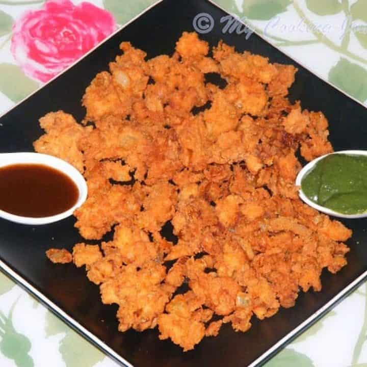 Onion Pakoda with tamarind and green chutney - Featured image.