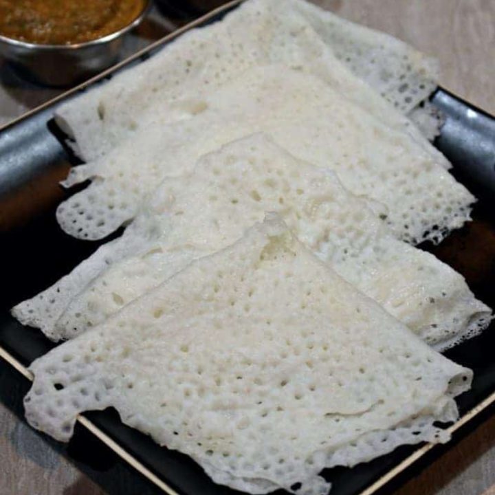 Neer Dosai stacked in a black plate - Featured Image