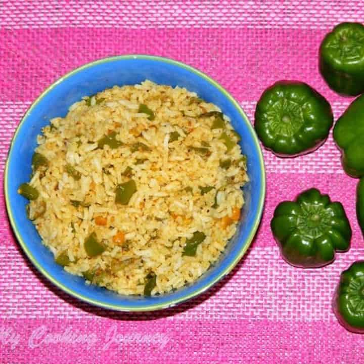 Bell Pepper Rice in a bowl and bell peppers on the side - Featured Image