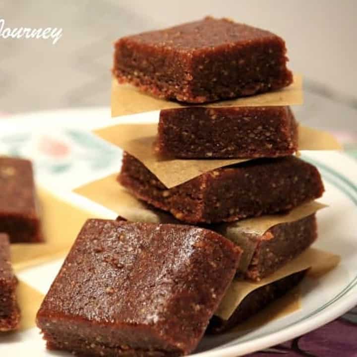 Energy bars stacked on top of each other in a white plate - Featured Image