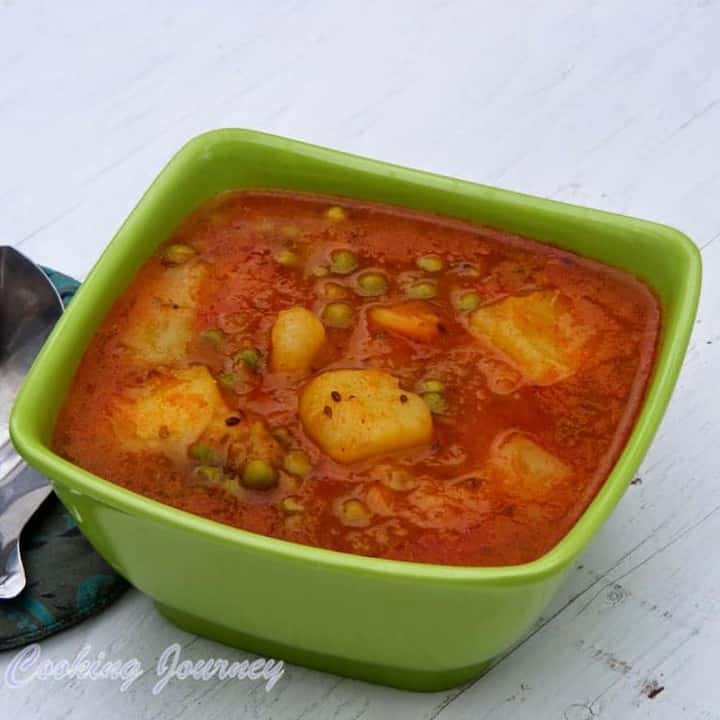 Banarasi Aloo Mater in a green bowl - Featured Image