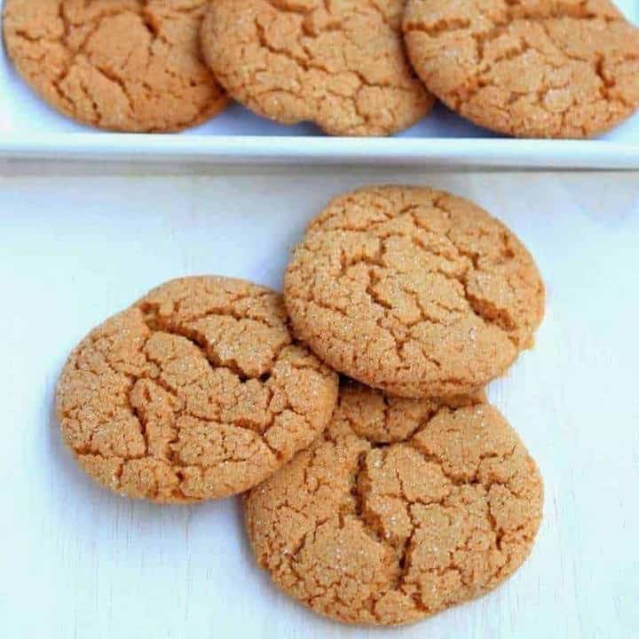 Old Fashioned Ginger cookies on a board with few in a plate - Featured image