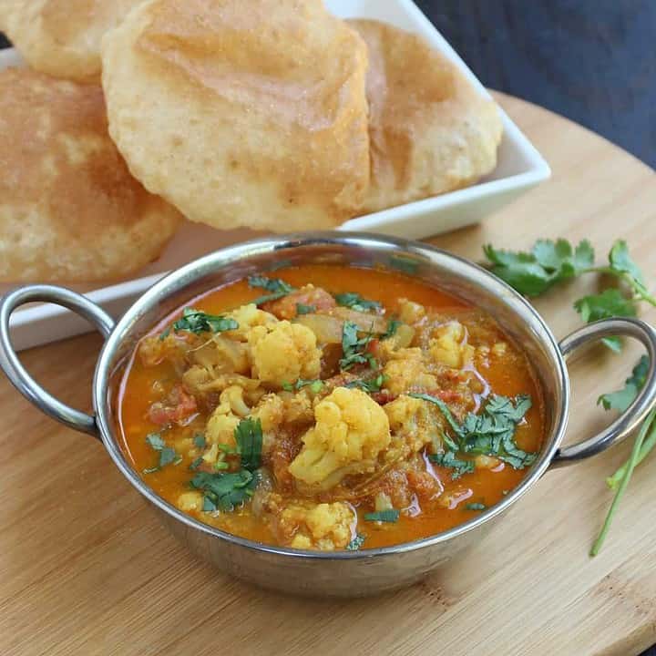 Cauliflower Kurma in a stainless steel bowl - Featured Image