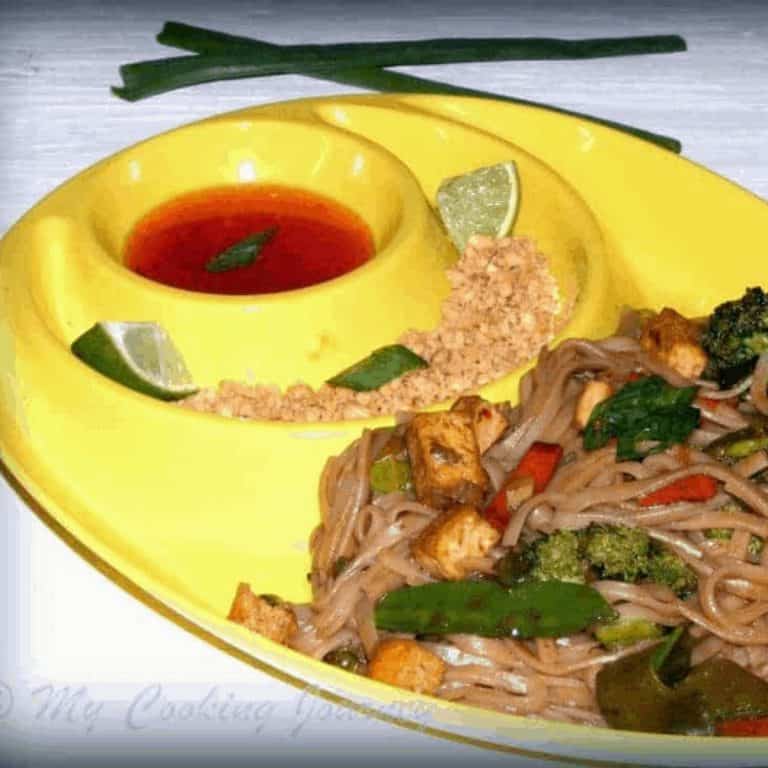 Pad Thai with crushed peanuts and sauce on the side - Feature Image