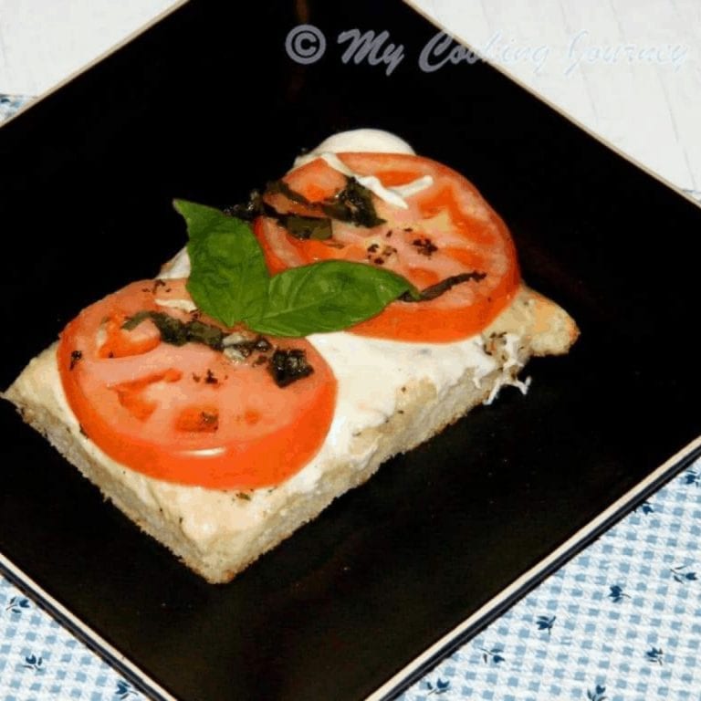 Foccacia Caprese in a black plate - Feature Image