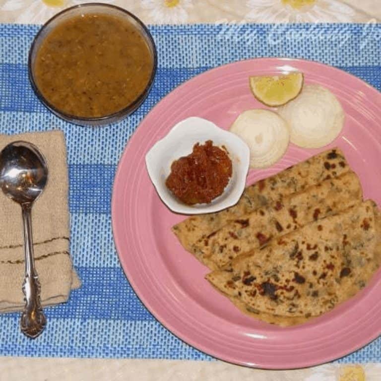 Aloo Methi Paratha in a pink plate with sides - Feature Image